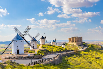 landscape mill spain clouds and castle La Mancha Consuegra with blue sky with clouds - obrazy, fototapety, plakaty