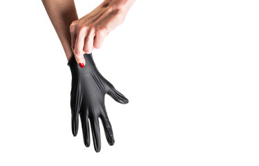 Hand in black gloves of a doctor or hairdresser on a white background.