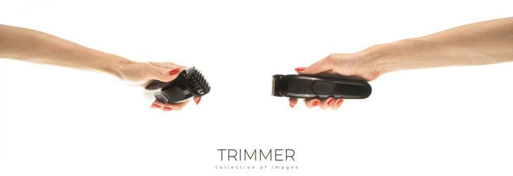 Hair Trimmer In Hand Isolated On The White Background.