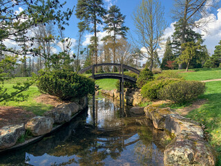 Fototapeta na wymiar Dawes Arboretum Japanese Garden with Koi pond and water reflections on a sunny day
