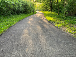 Jim Simmons Memorial Trail In Marysville Ohio. Walking and bike path through a forest.