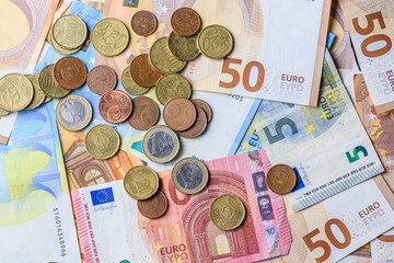 10,20, 50 euro bills and coins as background 13