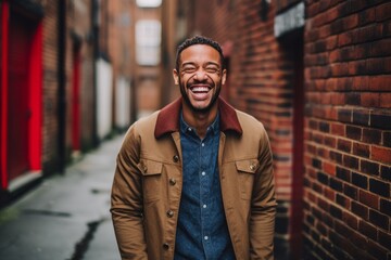 Fototapeta premium Headshot portrait photography of a happy boy in his 30s walking against a brick wall background. With generative AI technology