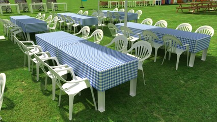 Plastic table and blue napkin cover for outdoor party or picnic in the garden for summer season. 