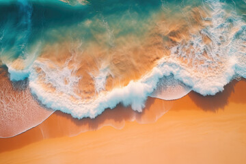 Beautiful aerial perspective of sandy beach and clear blue water at sunset