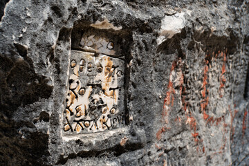 ancient carvings at Gramma Bay beach in Albania