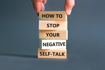 Stop negative self-talk symbol. Concept words How to stop your negative self-talk on wooden block....