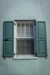 Close up of the color windows of a colonial era home in Charleston, South Carolina