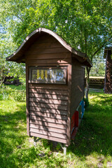 Set of wooden beehive in the spring garden, closeup. Large wooden bee house