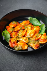 ravioli pesto sauce tomato sauce healthy meal food snack on the table copy space food background rustic top view