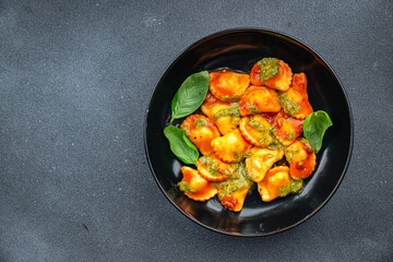 ravioli pesto sauce tomato sauce healthy meal food snack on the table copy space food background rustic top view