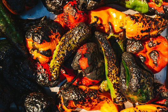 A pile of colorful charred roast peppers, closeup