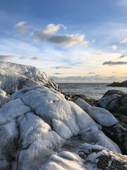 Ice encased rocks on the beach in Little Compton Rhode Island