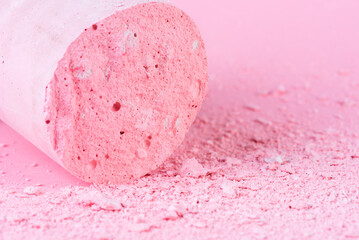 Crumbs and chunk of pastel chalk close-up view