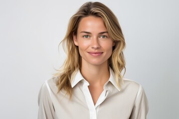 Medium shot portrait photography of a grinning girl in her 30s wearing a sophisticated blouse against a white background. With generative AI technology