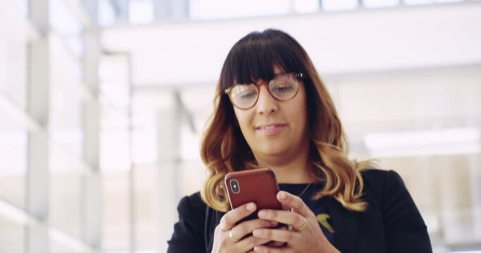 Phone, walk and a business woman networking in the office for professional work. Communication, thinking and glasses with a happy young female employee typing a text message in a corporate workplace