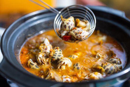 Bowl of sea snail in spicy sauce