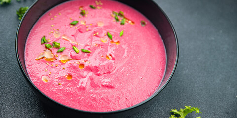 cream soup beetroot beet, leek potatoe first course meal food snack on the table copy space food background rustic top view