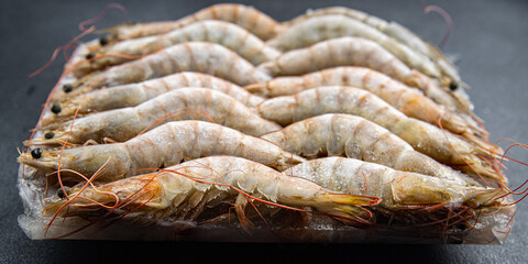 frozen shrimp raw gambas seafood prawn meal food snack on the table copy space food background rustic top view 