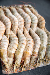 frozen shrimp raw gambas seafood prawn meal food snack on the table copy space food background rustic top view 