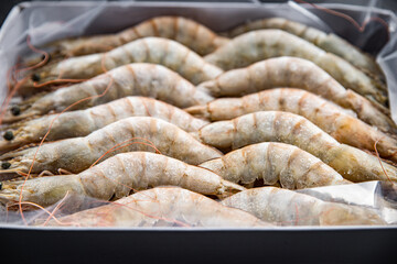 frozen shrimp raw gambas seafood prawn meal food snack on the table copy space food background rustic top view 