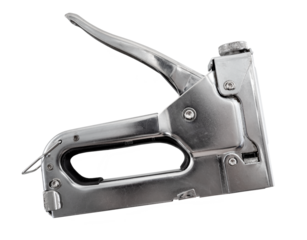 Industrial stapler for working with staples on a white background. Stapler with signs of wear and abrasions