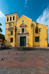 Cartagena, Bolivar, Colombia. March 15, 2023: park and trinity church with blue sky.