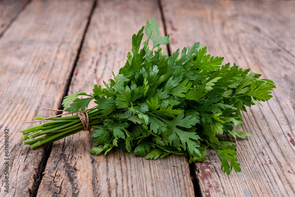 Wall mural Parsley on wooden background