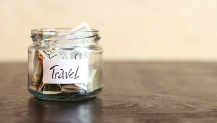 Piggy bank with dollars for travel. Accumulation of financial concept. Saving. Glass jar with money