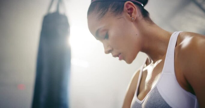 Fitness, boxing or girl wrapping hands in martial arts in gym or strong fighter starting exercise. Hand, boxer training in combat or sports athlete in kickboxing workout preparation ready to fight