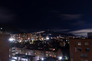 Fototapeta premium Beautiful night cityscape of bogota viewed from a roof top 
