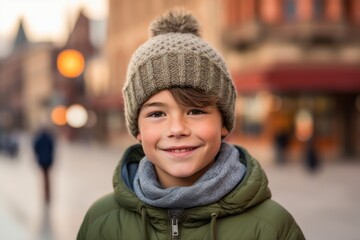 Headshot portrait photography of a grinning kid male wearing a warm beanie or knit hat against a picturesque old town background. With generative AI technology
