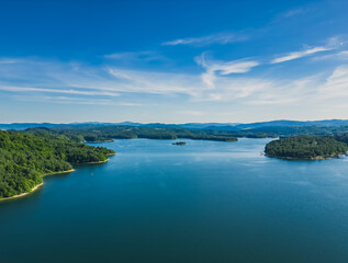 Fototapeta na wymiar Panoramic view from the drone during sunset, on the Solina Lake over the Solina water dam, in the Polish Bieszczady Mountains, Poland