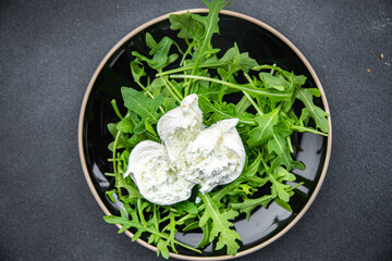 buratta salad arugula green leaves cheese burratina healthy meal food snack on the table copy space food background rustic top view