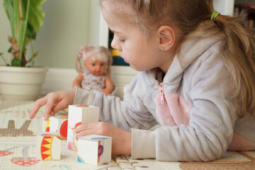 Obraz na płótnie Canvas Little cute girl spending time in the playroom