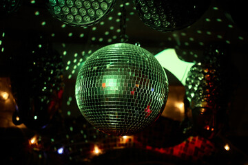 Colorful disco mirror ball lights night club background.