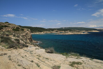 Fototapeta na wymiar Stony wild Kastelina beach on the island of Rab in Croatia