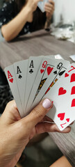 Close up of women hand holding playing cards. gambling.