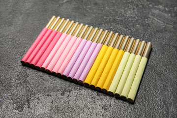 Set of colorful cigarettes on dark background. Stop smoking concept