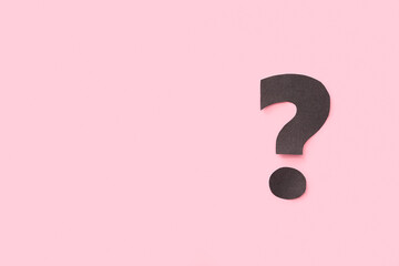 Paper question mark on pink background