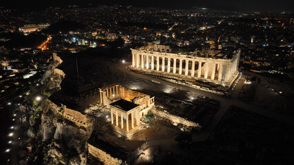 Aerial drone night shot of iconic illuminated Acropolis hill and the Parthenon an Unesco world heritage site and one of the most important monuments of Western civilisation, Athens, Attica, Greece