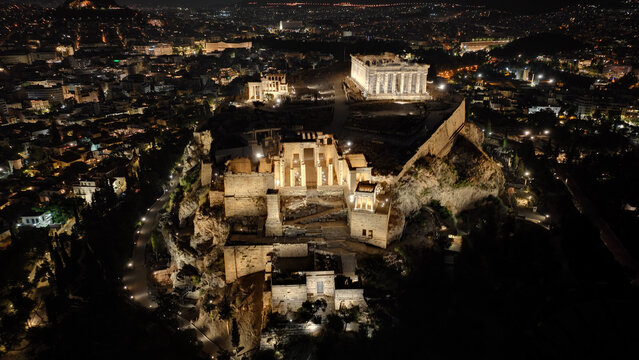 Aerial drone night shot of Acropolis hill propylaea propylea or propylaia entrance gateway, Athens, Attica, Greece