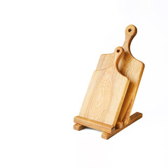 Two vintage solid oak wooden cutting boards with oval handles and a stand on a white background....