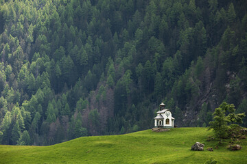 Small white chapel church on the hillin Austria.