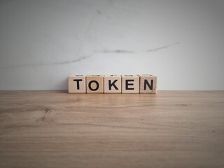 Word token from wooden blocks. NFT, technology concept