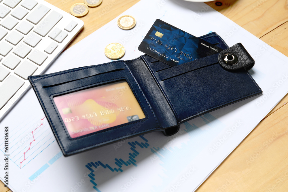 Sticker wallet with credit card and keyboard on wooden table