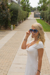 pretty woman in the street with glasses