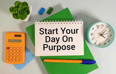 Start Your Day On Purpose text on notepad, concept background