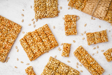 Assortment of tasty kozinaki on white background