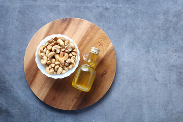 cashew nuts and oil on table 